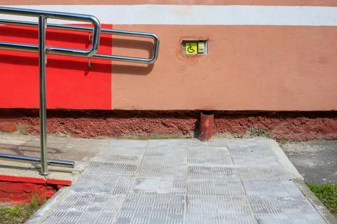 Disabled call button assistance system is installed near an accessible wheelc Stock Photos