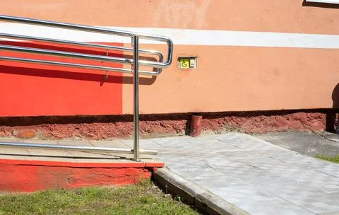 Disabled call button assistance system near an accessible wheelchair ramp. .. Stock Photos