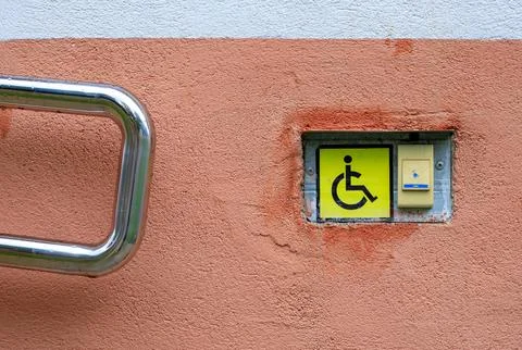 Disabled call button assistance system near an accessible wheelchair ramp. .. Stock Photos