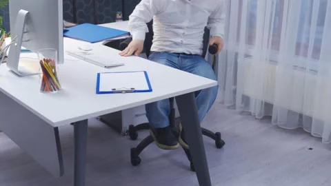 The disabled dwarf man is walking towards his office. Close-up feet. Stock Footage 230979120