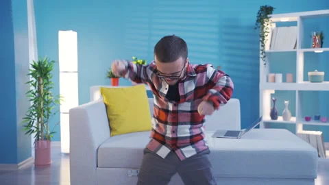 Disabled dwarf young man very happy and rejoices using laptop. Success concept. Stock Footage 230973873