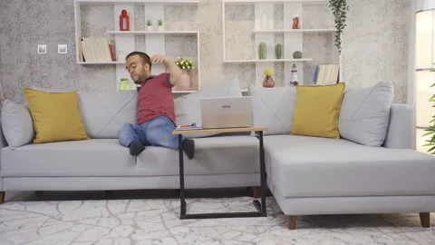 Disabled dwarf young man working in home office is thoughtful about his job. Stock Footage 230969026