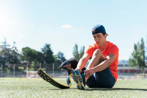 Disabled man athlete ready for training with leg prosthesis. Stock Photos