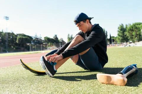 Disabled man athlete ready for training with leg prosthesis. Stock Photos