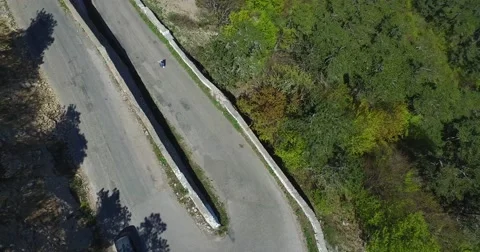 Disabled Man On A Mountain Serpentine Road Video stock 64545679