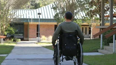 Disabled Man Rolling Away Stock Footage 12530101