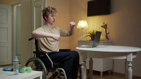 A disabled man is spreading his arm in different sides Stock Footage 163184466