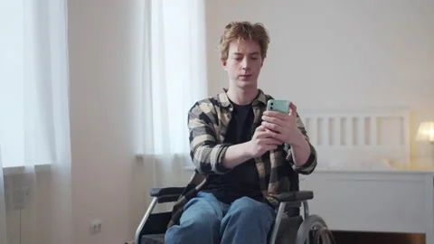 A disabled man is taking a photo Stock Footage 163183377