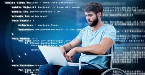 Disabled man typing coding text  in wheelchair Stock Photos