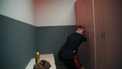 Disabled man with underdeveloped arms in a locker room Stock Footage 322017262
