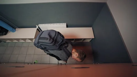 Disabled man with underdeveloped arms opening locker Video stock 322017317
