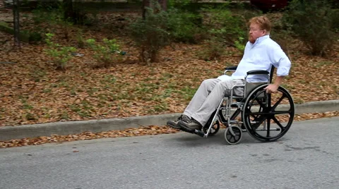 Disabled Man Using Wheelchair Pan Stock Footage 48915614