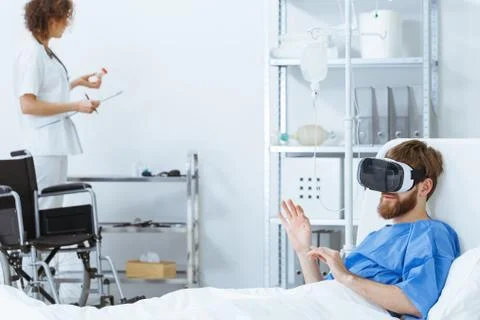 Disabled man in VR goggles 스톡 사진