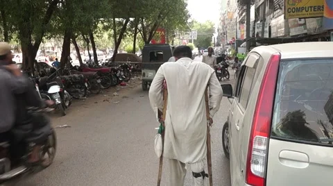 Disabled man walking on road 스톡 동영상 53352213