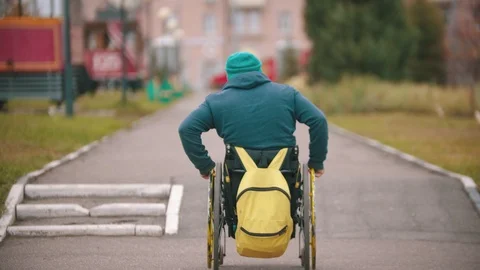 Disabled man in wheelchair getting up over a ramp Stock Footage 118793539
