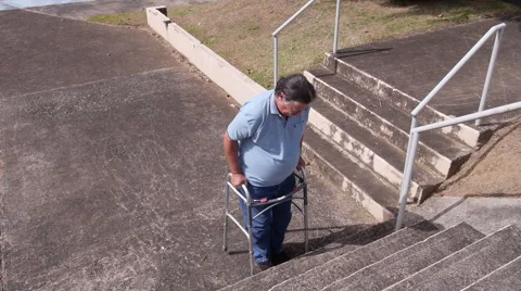 DISABLED-PARAPLEGIC man with walker and stairs 3 Stock Footage 51858974