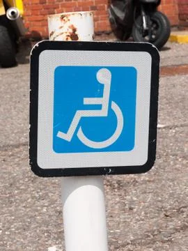 Disabled parking sign on post a train station Stock Photos