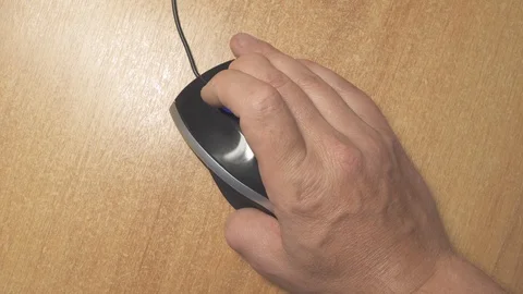 Disabled person sitting at the computer. The fingerless hand clicks the mouse. Stock Footage 111255722