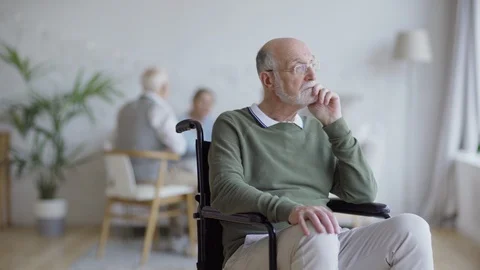 Disabled senior man deep in thought Stock Footage 117530733