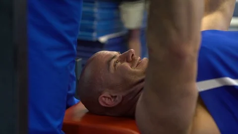 Disabled serviceman lifting weights in preparation for wounded warrior games Stock Footage 106561704