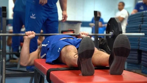 Disabled serviceman lifting weights for wounded warrior training  Stock Footage 106561712