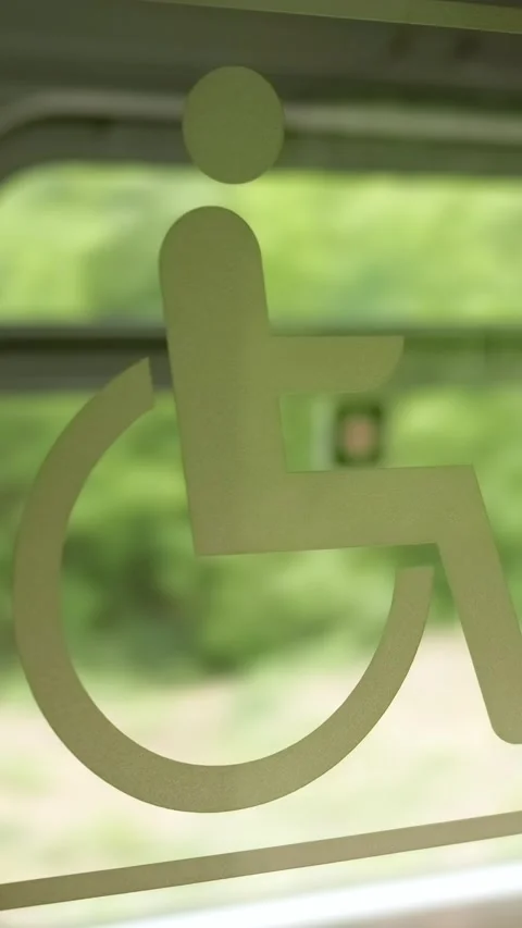 "Disabled" sign on the side of the window in the compartment of a moving tr.. Stock Footage 306150241