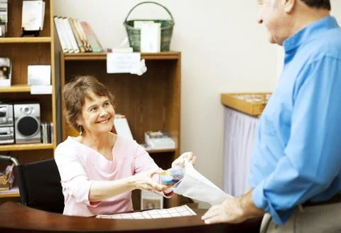 Disabled Store Clerk Stock Photos