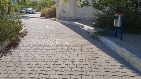 Disabled walk way in a campus and arrows show direction Stock Footage 159488540