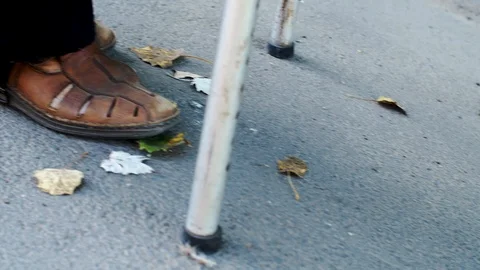 Disabled on a Walker is on the road, close up Stock Footage 116316136