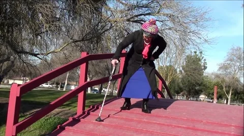 Disabled Women Having Difficulty Walking On Wood Bridge Stock Footage 59970837
