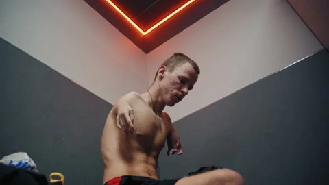 Disabled Young Man Changing Clothes in Gym Locker Room 库存影片 322017187