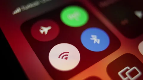 Disabling airplane mode on a smartphone, turning on Wi-Fi on the screen Stock Footage 239275099