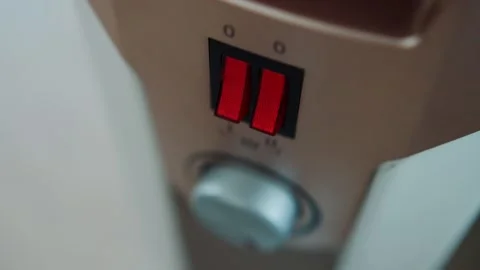 Disabling the keys on the electric heater control panel. The concept of turning Stock Footage 254060502