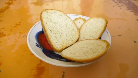 Disappearing and appearing white bread in a plate. Stock Footage 111808592