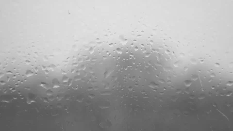 Disappearing Moisture on a Window Drops Rain Raining Wet Glass Droplet Stock-Footage 124910874