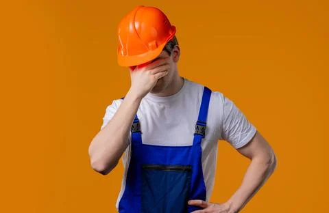 Disappointed builder foreman doing facepalm. Feeling regret, failure, dissa.. Stock Photos