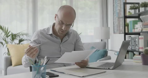 Disappointed businessman checking paperwork Stock Footage 162306253