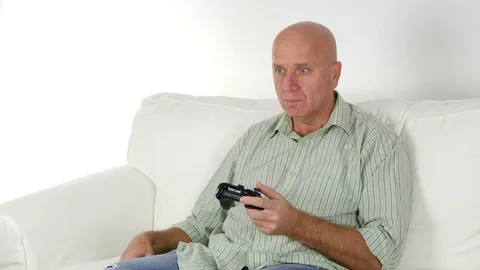 Disappointed Businessman Playing Games Using Wireless Remote at Home.  Stock Footage 71110920