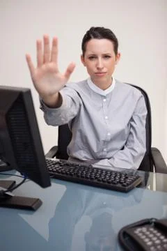 Disappointed businesswoman signals stop Stock Photos