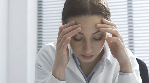 Disappointed doctor checking a patient's x-ray image Stock Footage 117896609