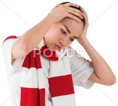 Disappointed football fan looking down Stock Photos