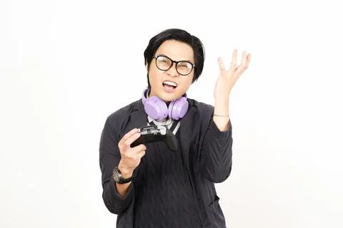 Disappointed gamer expressing regret while holding gamepad Stock Photos