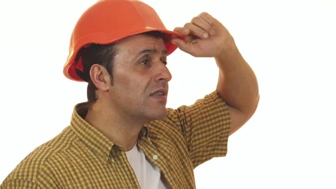 Disappointed Hispanic builder in hardhat expressing frustration Stock Footage 311952649