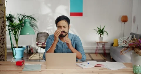 Disappointed Hispanic man feeling sadness and can not concentrate on computer Stock Footage 120743775