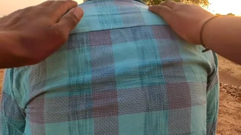 A disappointed man sitting, Two man patting his back Stock Footage 193243676