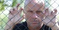 Disappointed Man Stay Back Metallic Fence Behind Border Immigrant Help Concept 4k or 4k+ Resolution