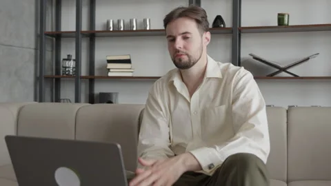 Disappointed Man Thinking Problem while Sitting at Computer Stock Footage 295194285