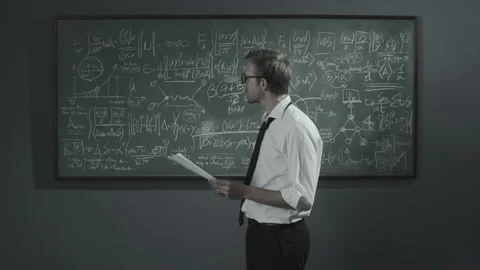 Disappointed mathematician erasing his work on the chalkboard Stock Footage 139259415