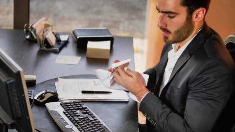Disappointed office worker at table Stock Photos