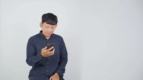 Disappointed Person Sighing While Holding Smartphone Vidéo 344830647